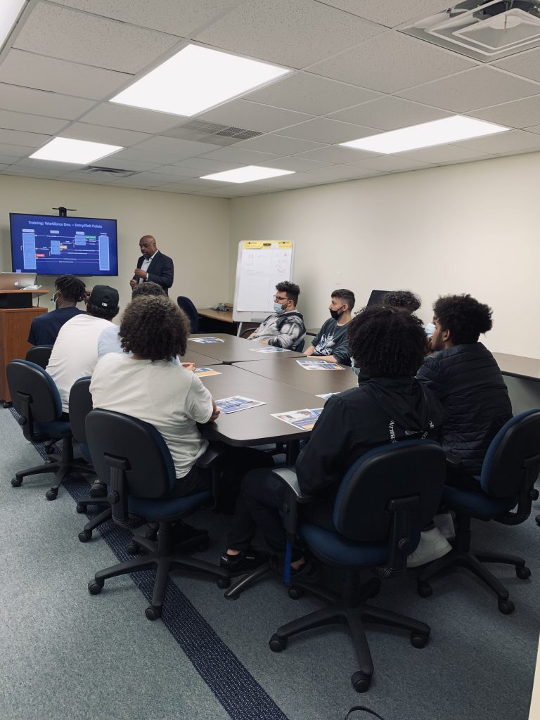 Students sitting around a conference table