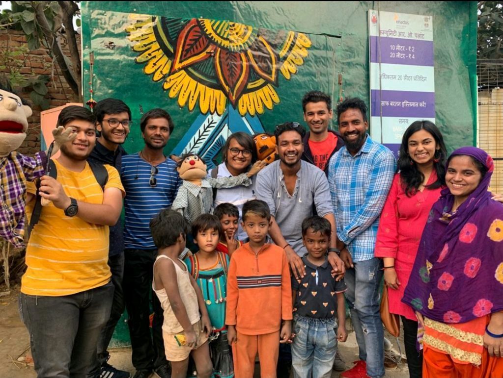 The Asbah team gathered with members of the community