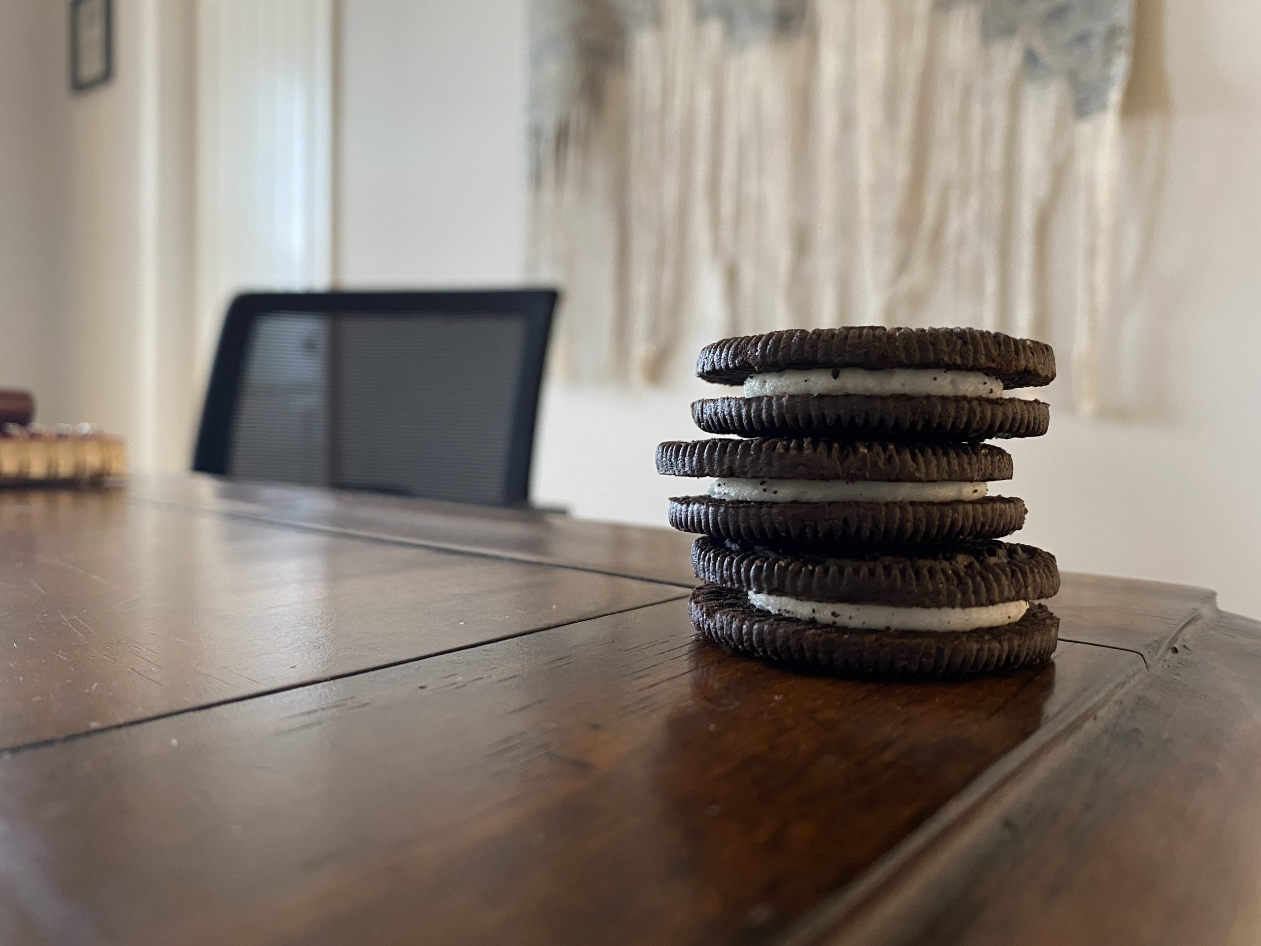 Oreos sitting on a desk. 