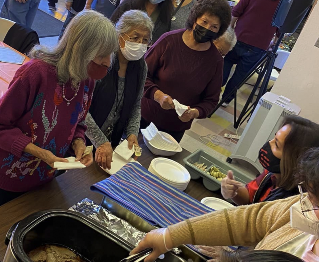 People wearing masks while volunteering