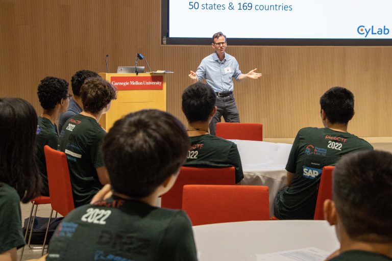 Students listening to a teacher giving a lecture