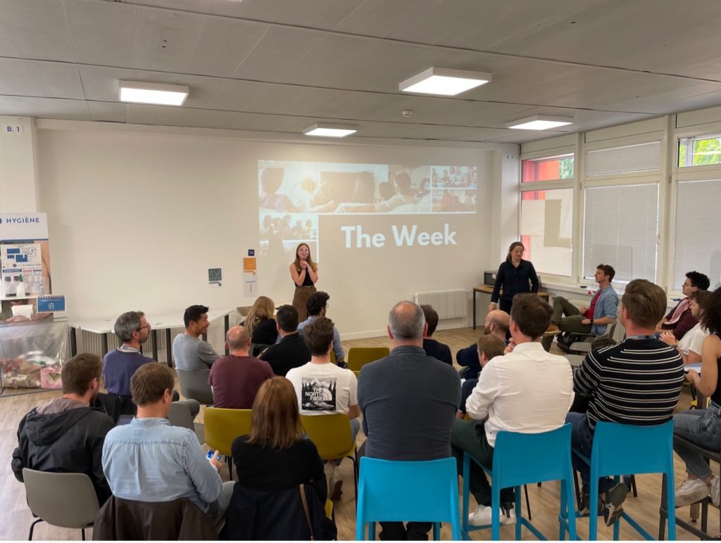 People gathered in a room to watch a movie