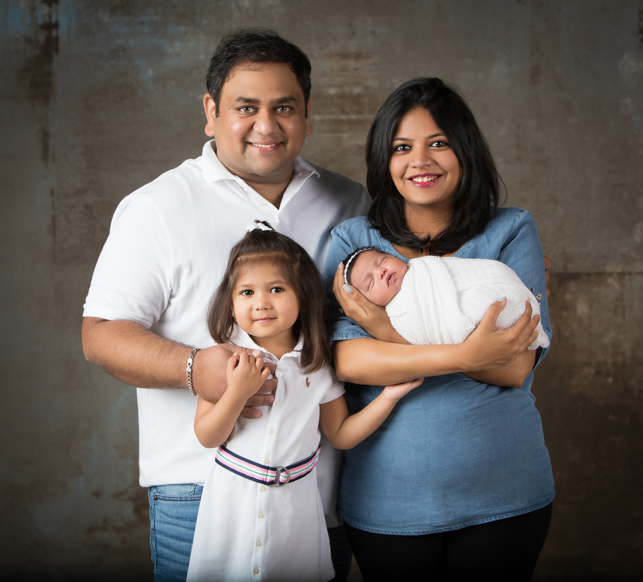 Pujita with her husband and two children. 