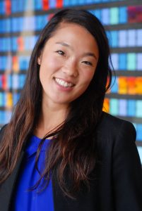 A woman wearing a blue shirt and a black blazer