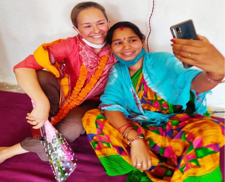 Two women taking a selfie together.