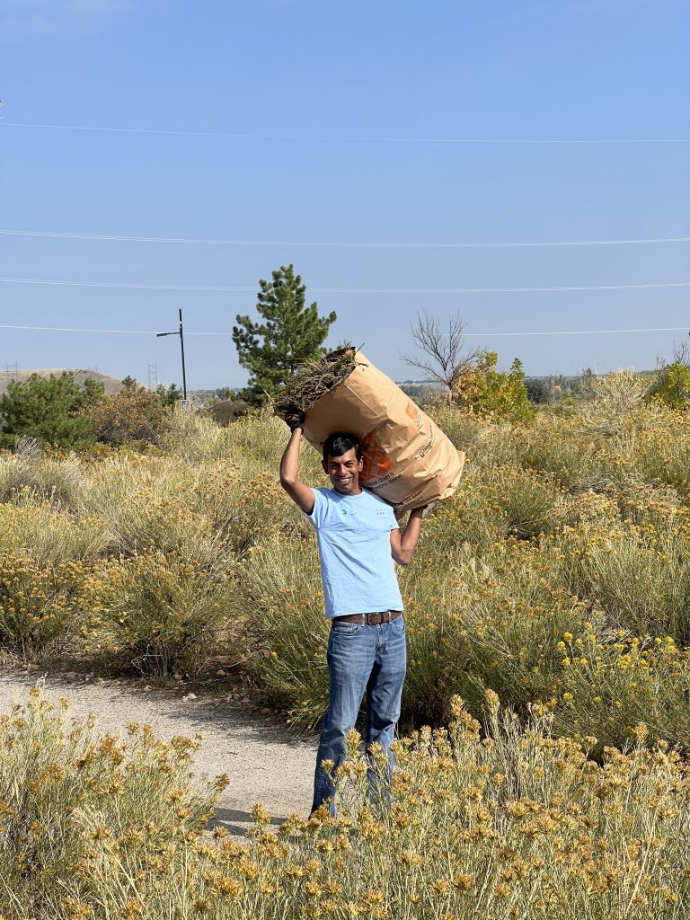A man carrying a bag over his shoulder