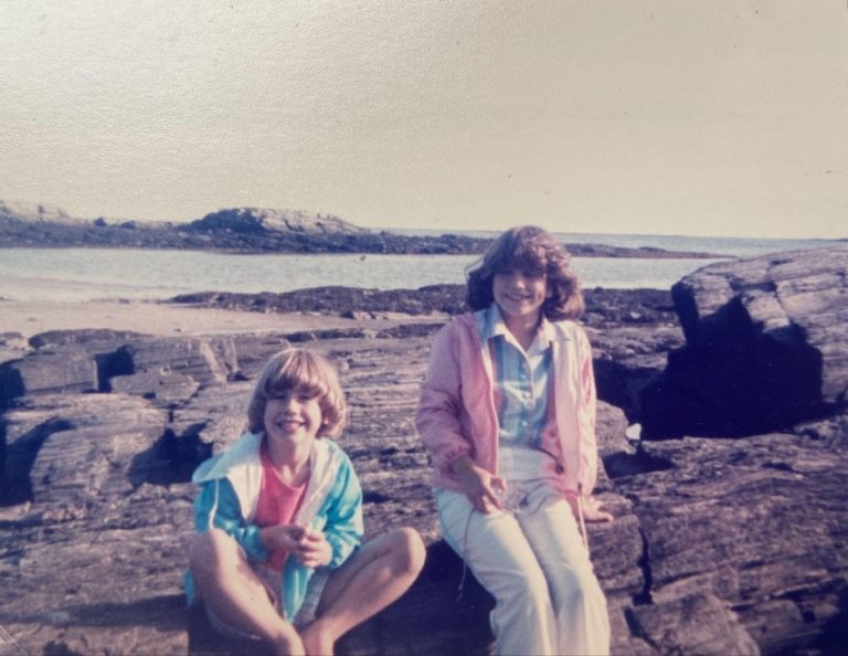 Two young girls near the ocean