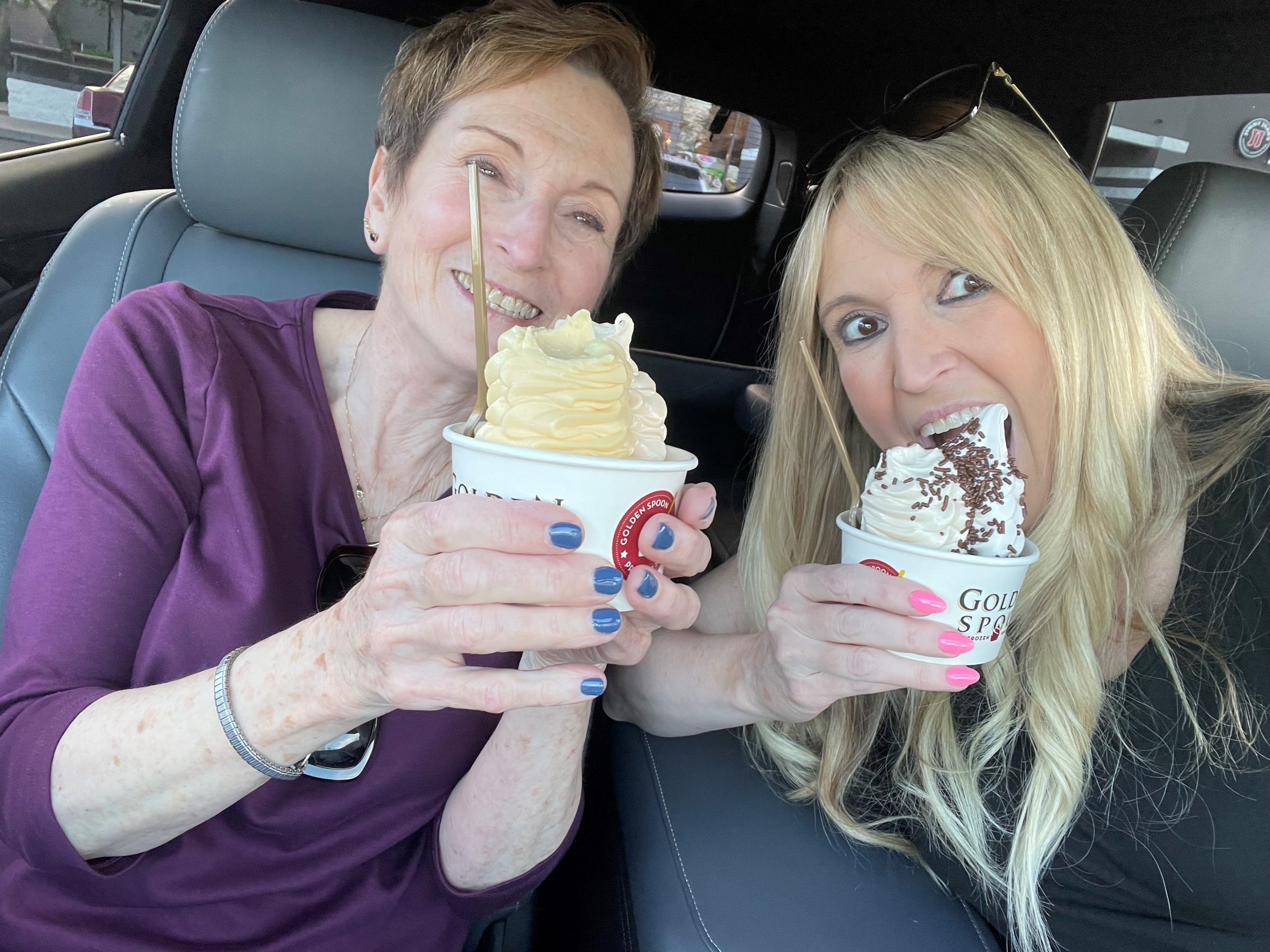 Rachel and her mother Judy eating foryo in a car. 