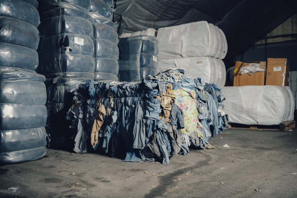 A pile of clothing in a warehouse