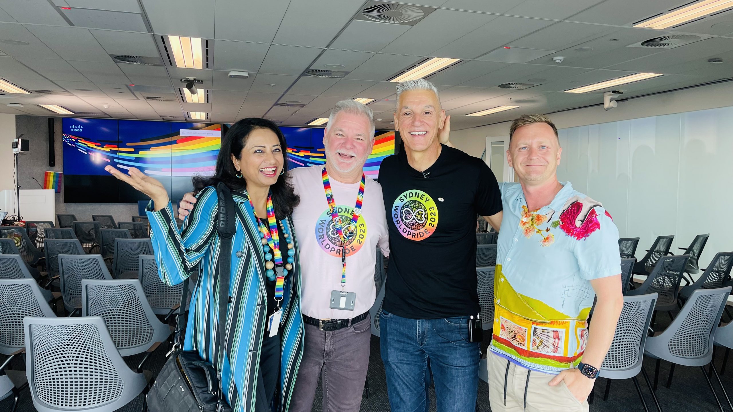 Varsha posing with three collegues.