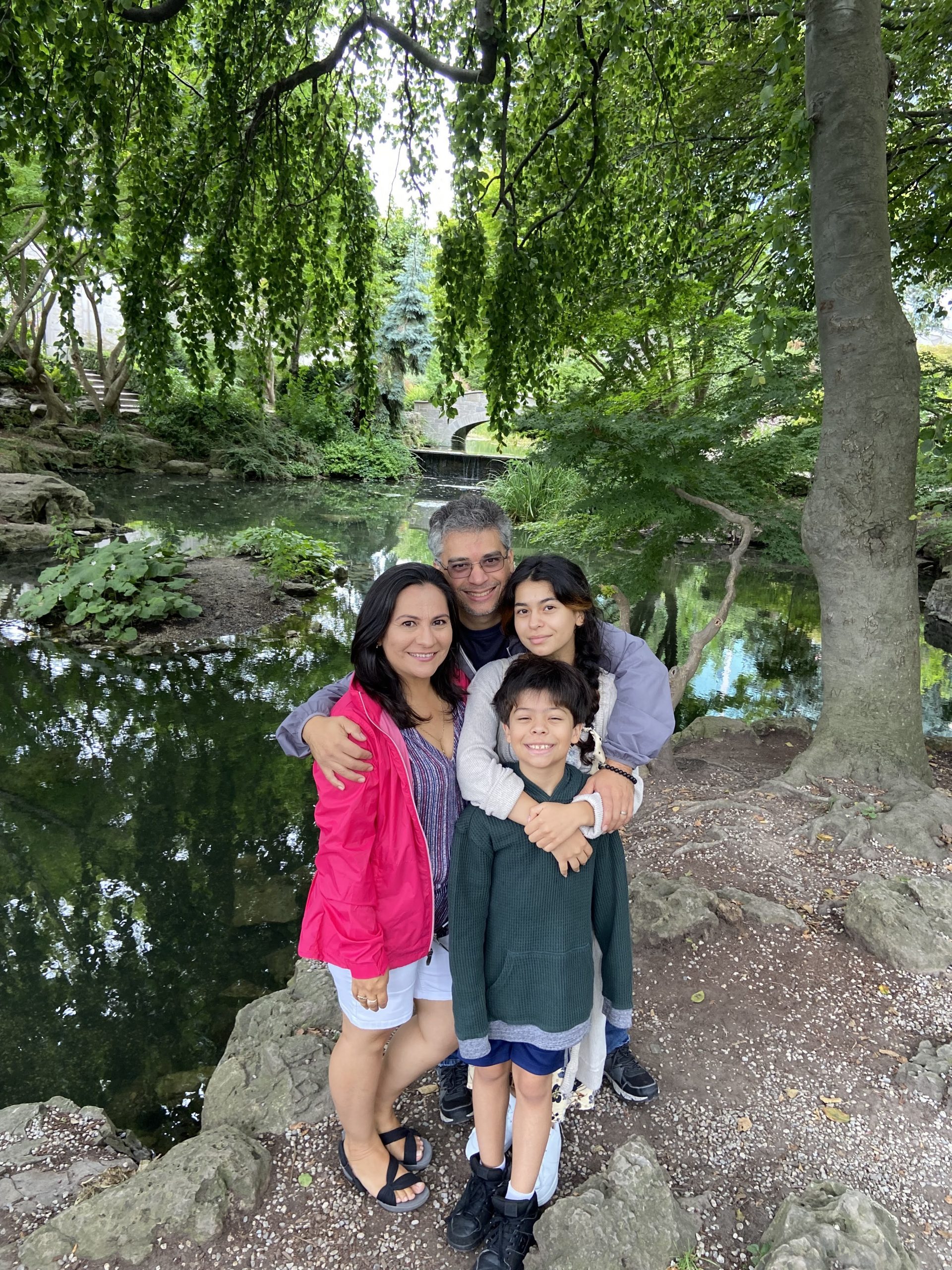 A mother, father, and two children in an outdoor setting