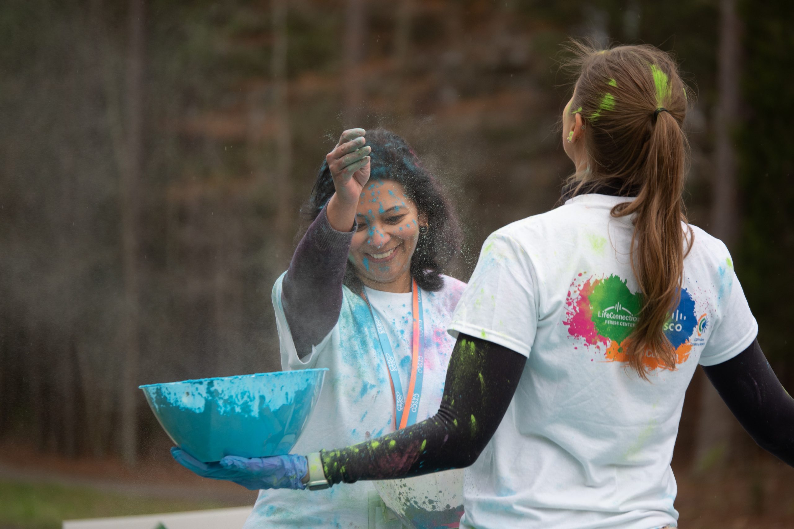 Prajakta throwing colored powder. 