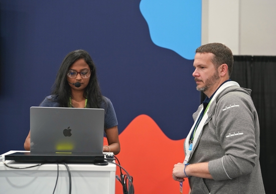 Akhila Pamukuntla and Hank Preston speaking at Cisco Live 2023 Las Vegas.