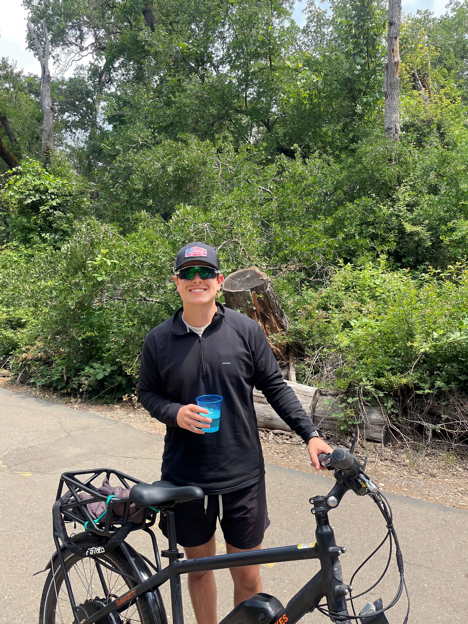 Nate with a bike in nature.