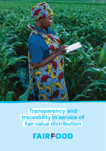 Woman with a tablet in a field of crops