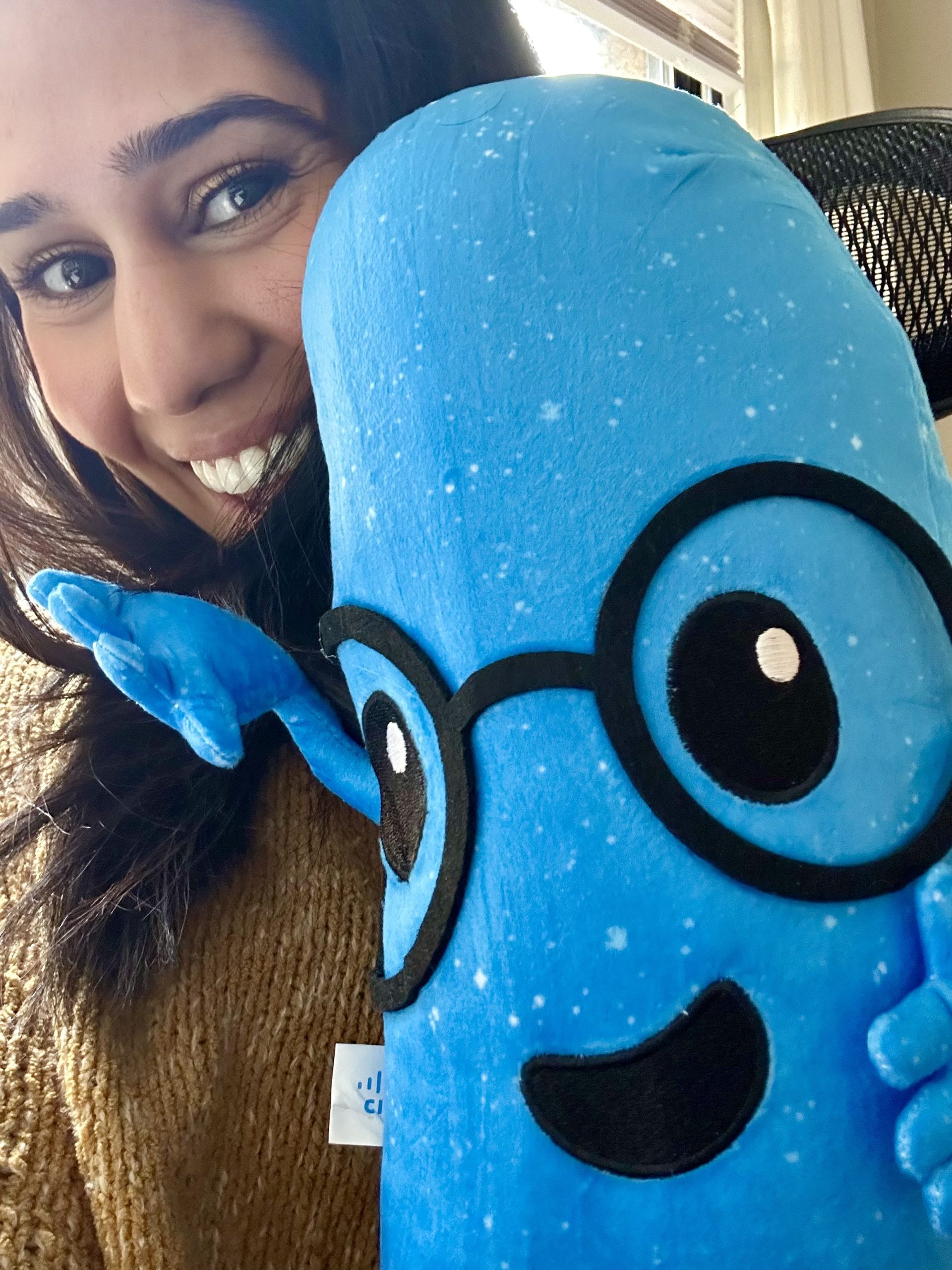 Selfie of Brinda with a Lumi plushie.