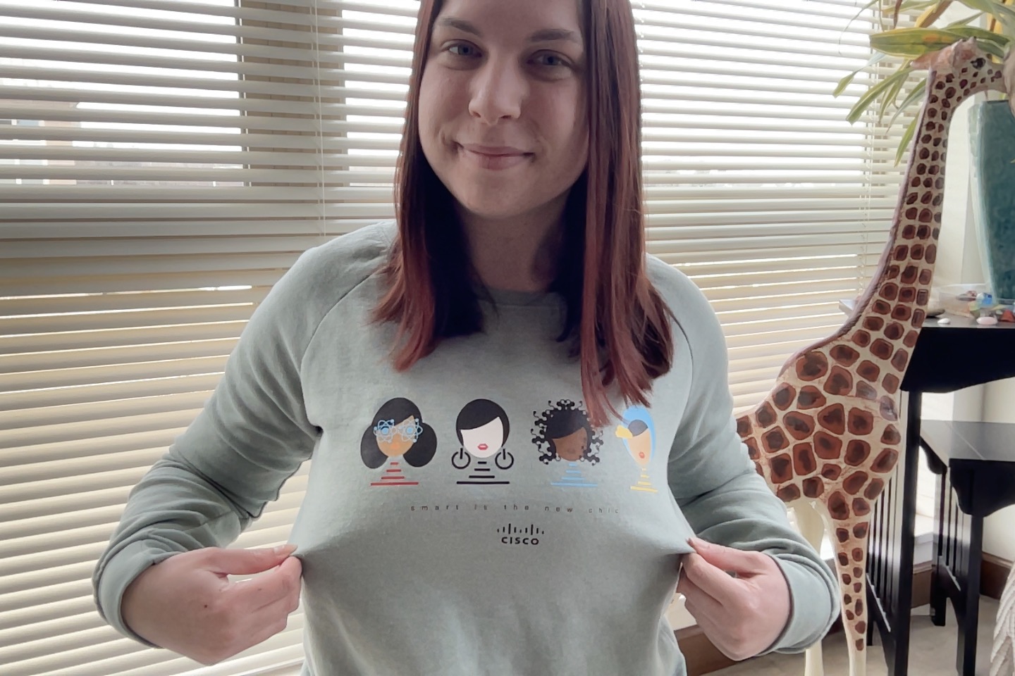 Anna wearing a Women of Cisco sweatshirt. 