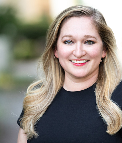 Headshot of Kristen Bennett, Service Year Alliance’s Chief Executive Officer, smiling