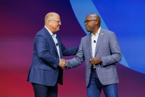 Jeff Sharritts and Rodney Clark on stage at Cisco Partner Summit 2023