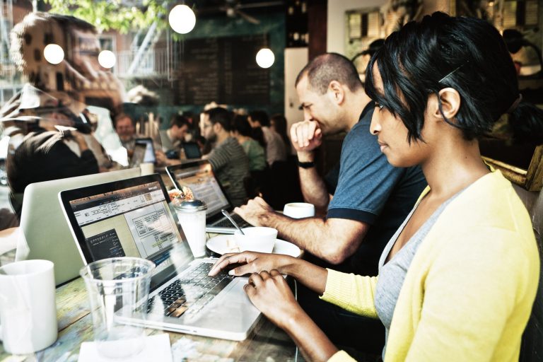 People working in office with technology