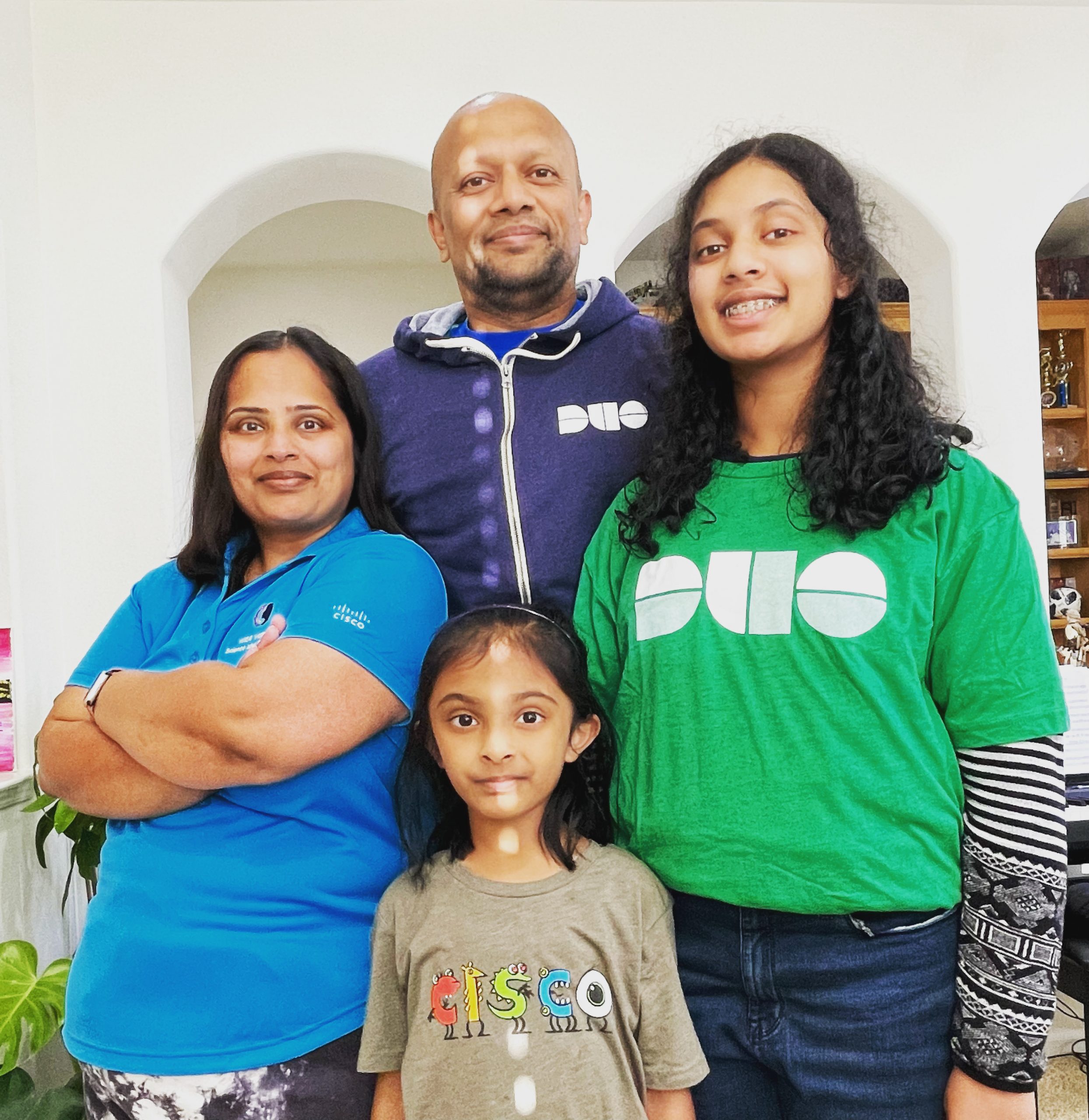 Netish, his wife and two daughters all wearing Cisco swag.