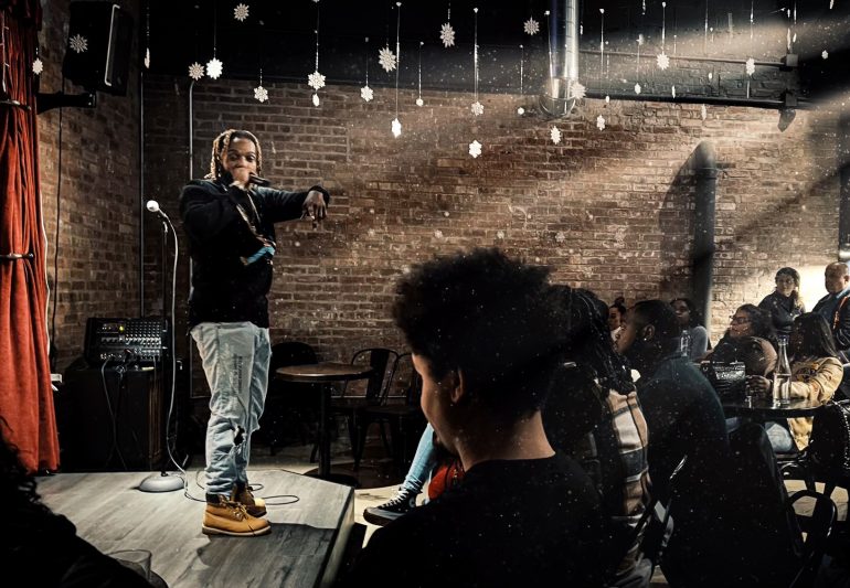 Person performing on stage.