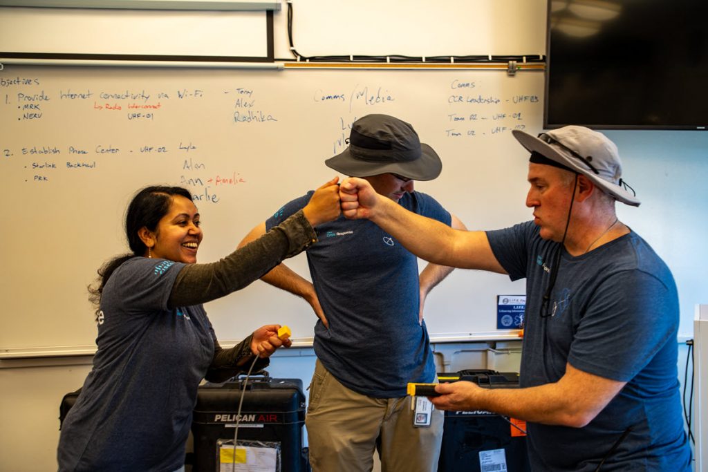 Volunteer team members working together during training exercise
