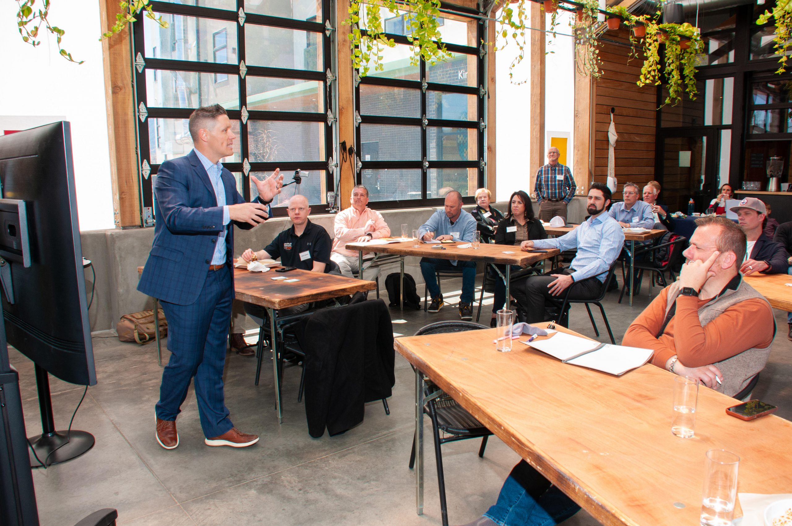 Travis talking to a group of people.