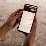 Hands holding a cell phone