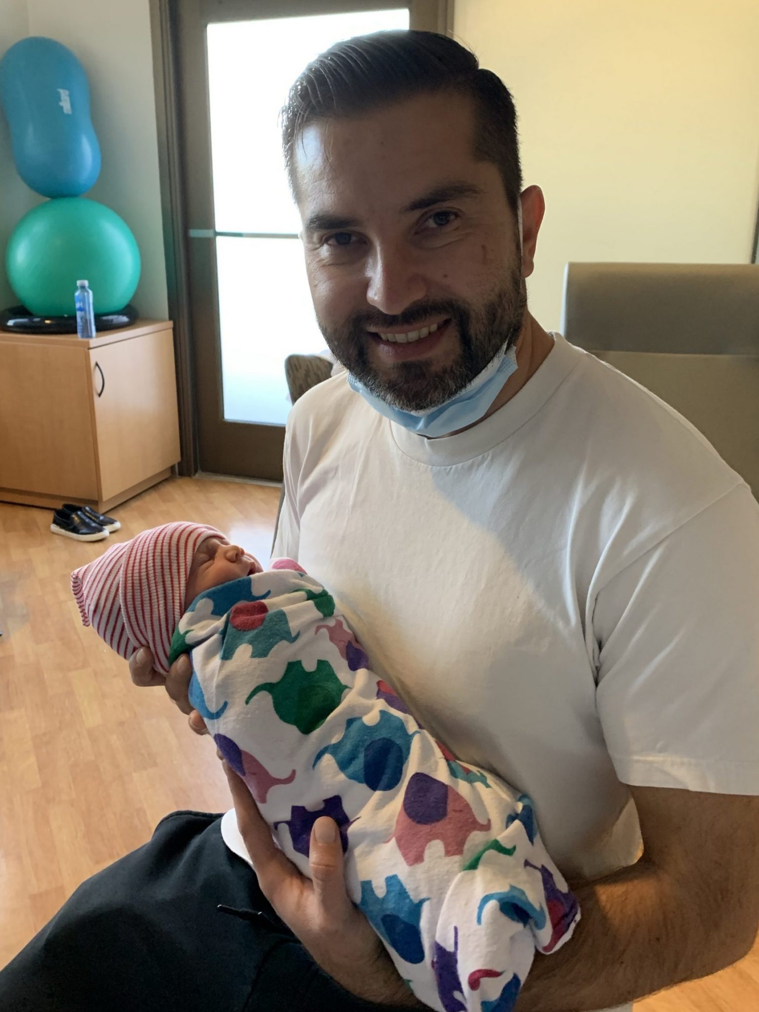 Wallid holding his new baby