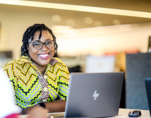 Women smiling with laptop