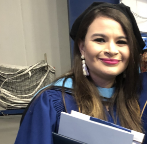 Dr Gabriella Arellano wearing graduate gown