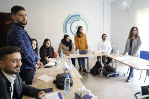 Group in Tanzania smiles as they participate in Climate Champions projects.