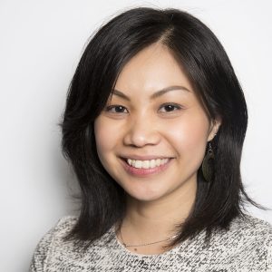 A woman wearing a black and white sweater