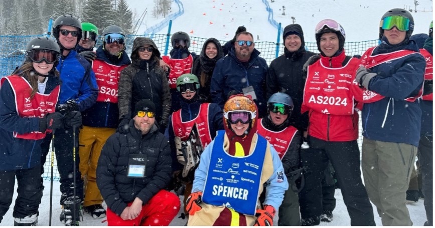 Image of group of athletes together in snowy landscape