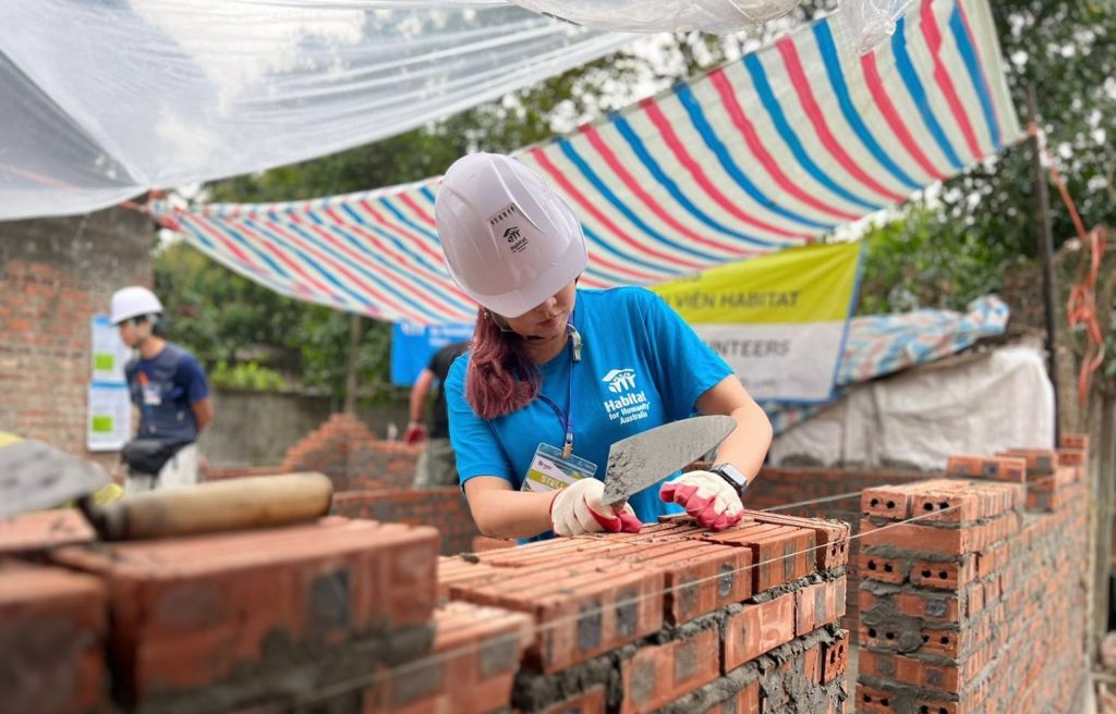 Volunteer doing some brickwork