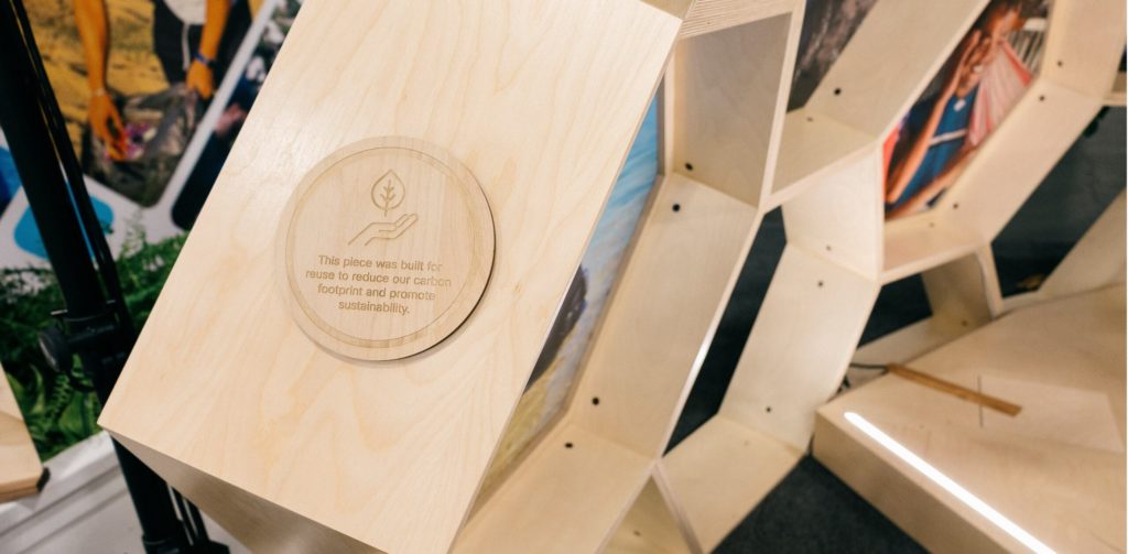 Image of wooden beam with a sustainability logo. 