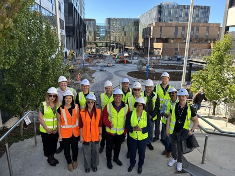 Group of Cisco representatives in hard hats on a site tour of Canberra Institute of Technology