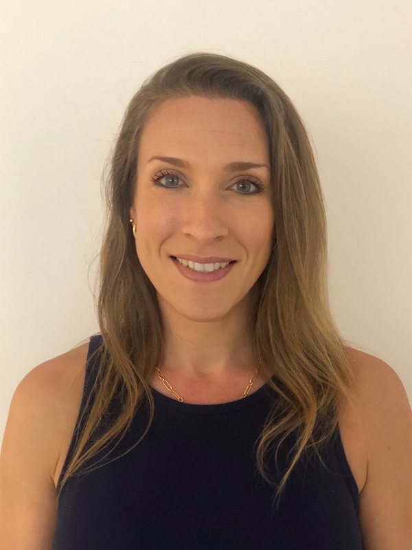 A woman with long hair wearing a black top