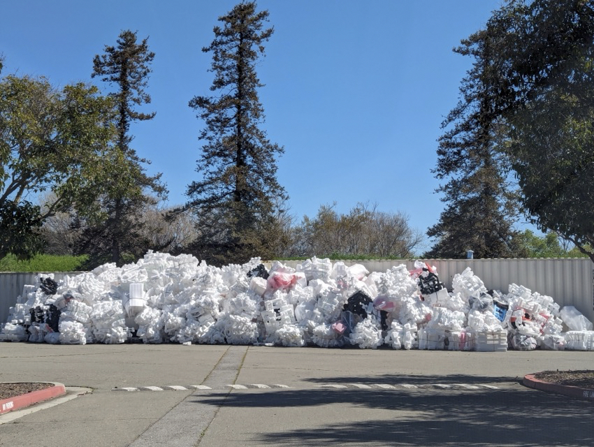 A pile of foam in a parking lot.