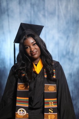 Headshot of Stephanie in graduation cap and gown. 