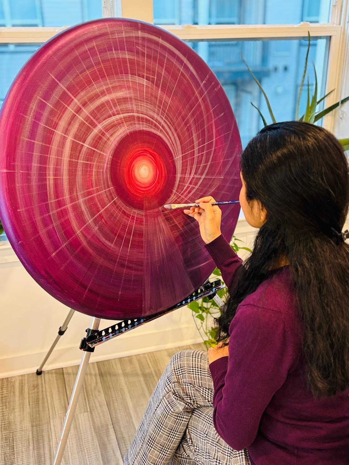 A Woman painting.