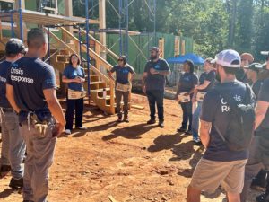Cisco volunteers standing in a circle at a construction build site in Western North Carolina.