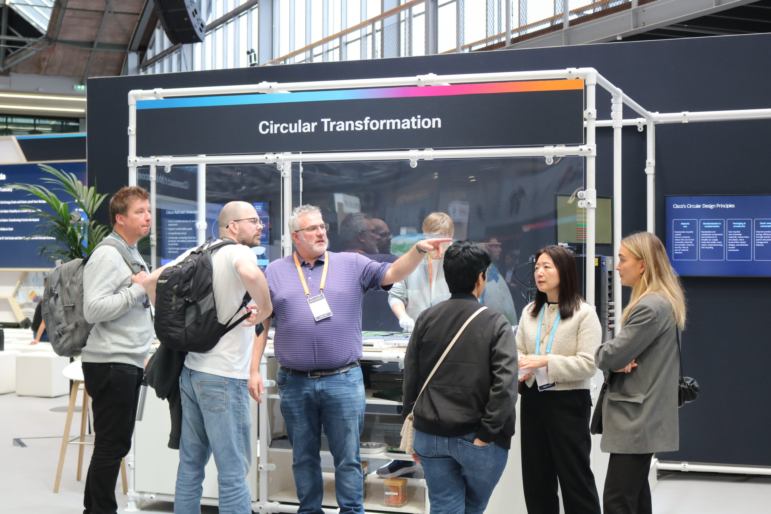 People standing in front of the Circular booth at Cisco Live.
