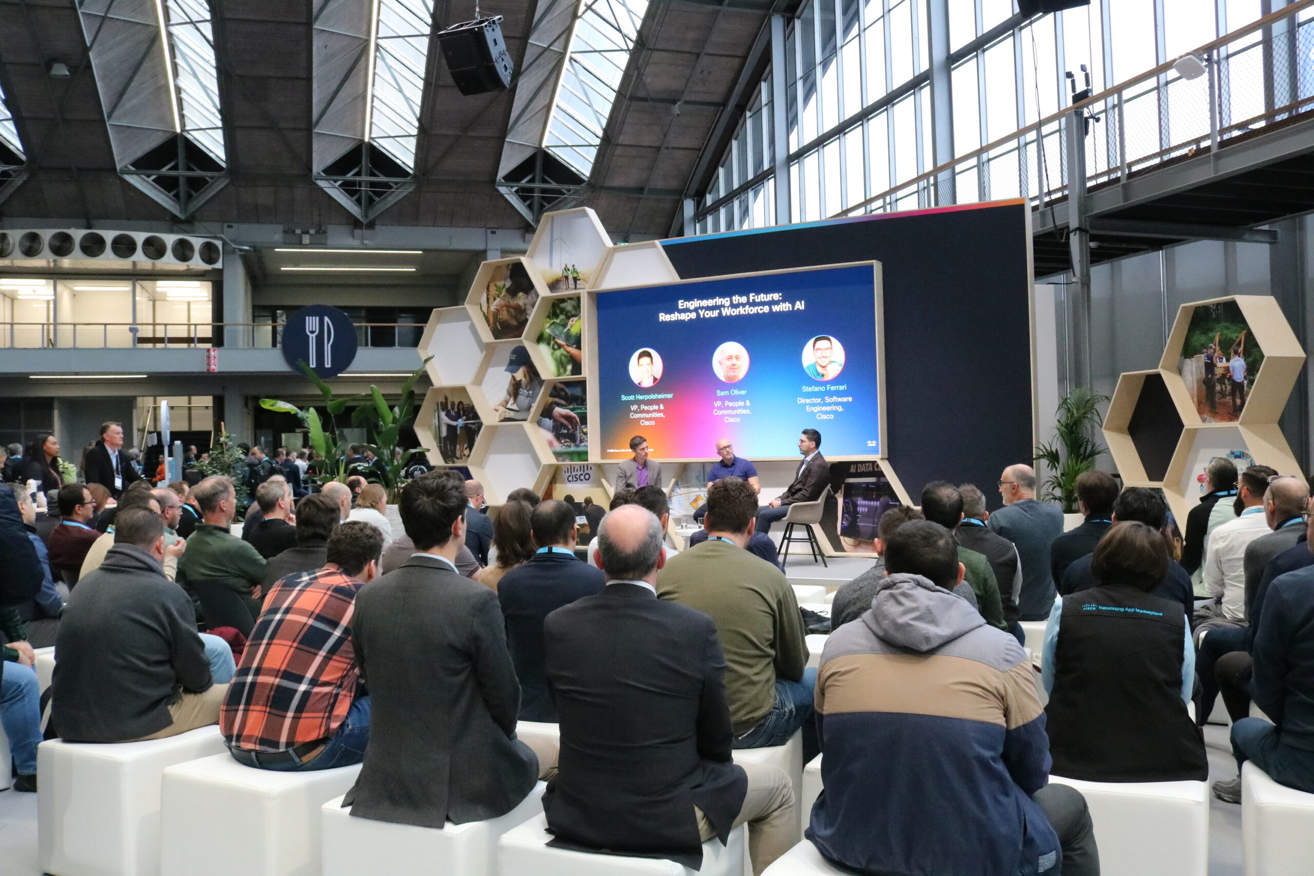 A group of people listening in to a session in the Purpose Pavilion.