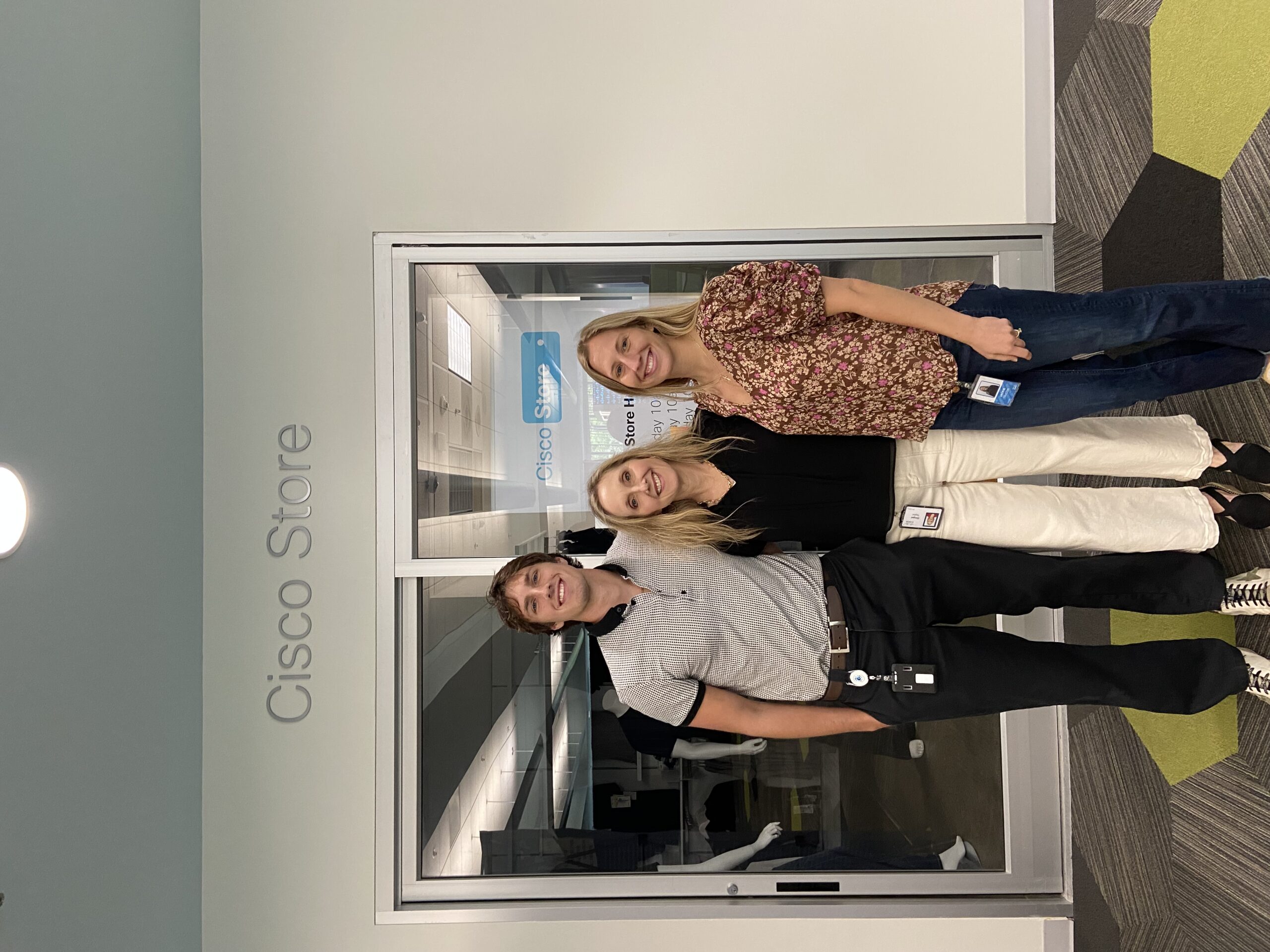 Mother, Daughter and Son in front of the Cisco store.