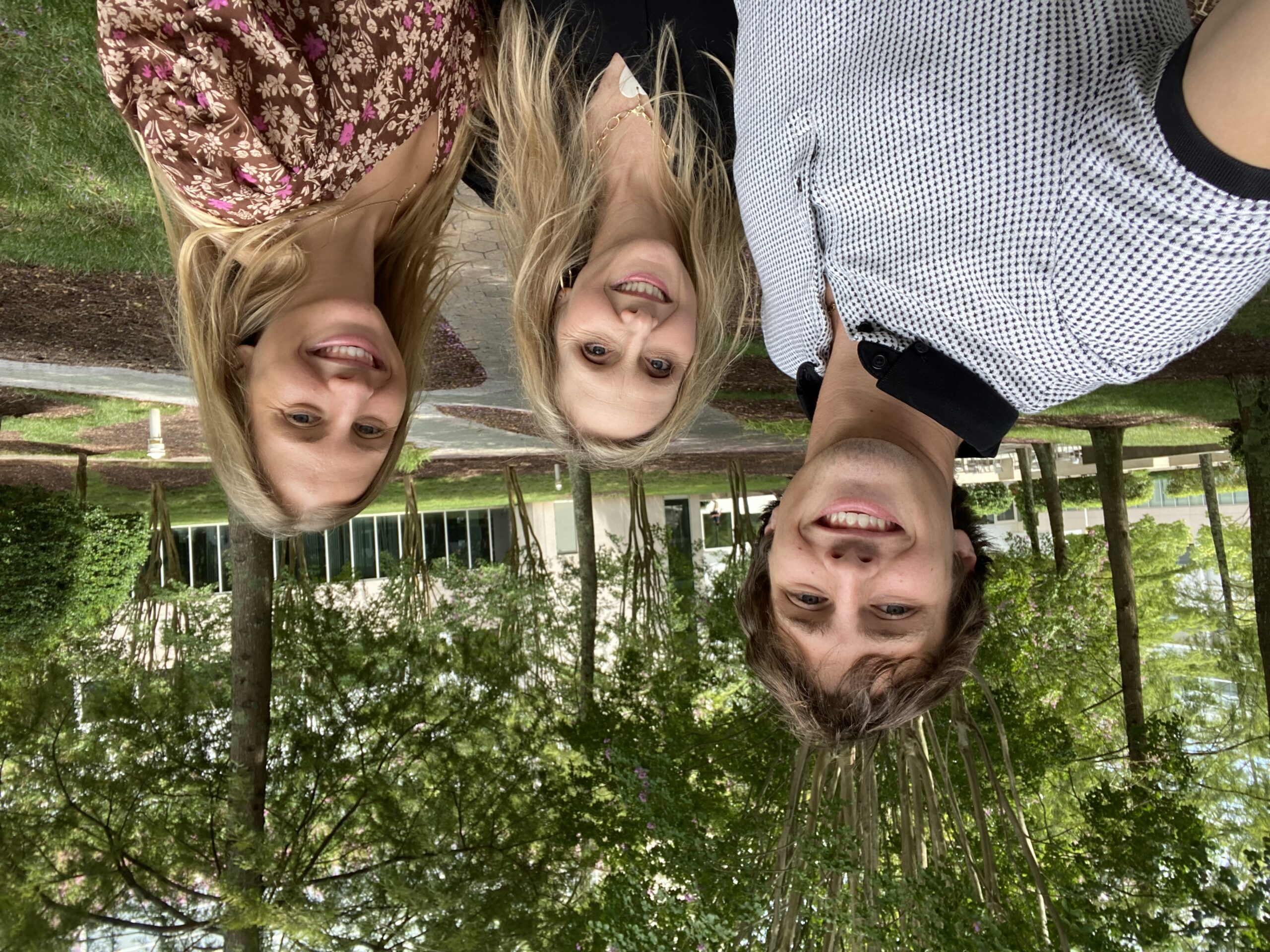 Brother, Sister and Mother smiling together on the Cisco campus.