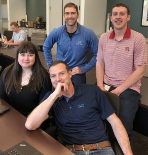 Dustin smiles with his Security Renewals team for US Public Sector and LATAM.