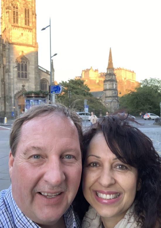 Ed smiling in front of Edinburgh Law Graduate School