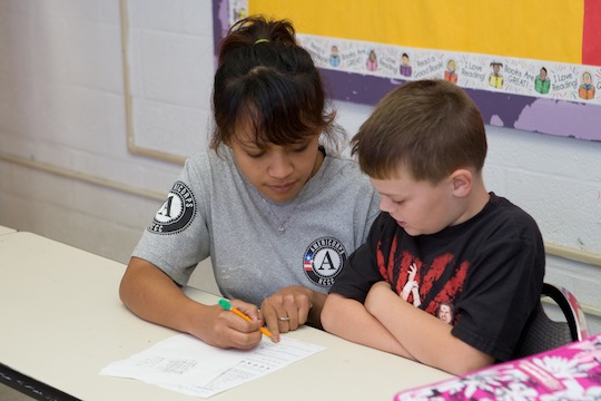 Young people who participate in "national service" support communities and help people improve their lives while developing skills that prepare them to succeed in the workforce.